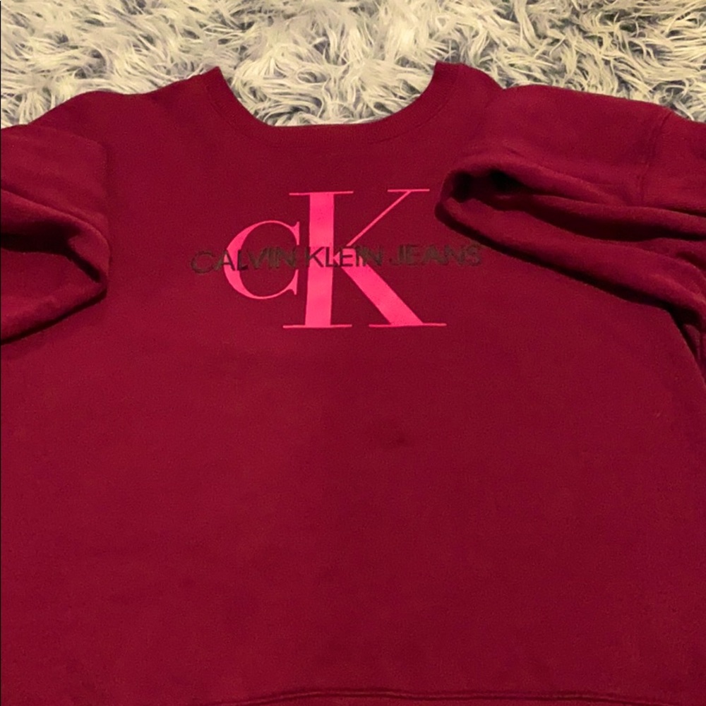 A magenta sweater with pink lettering from CK